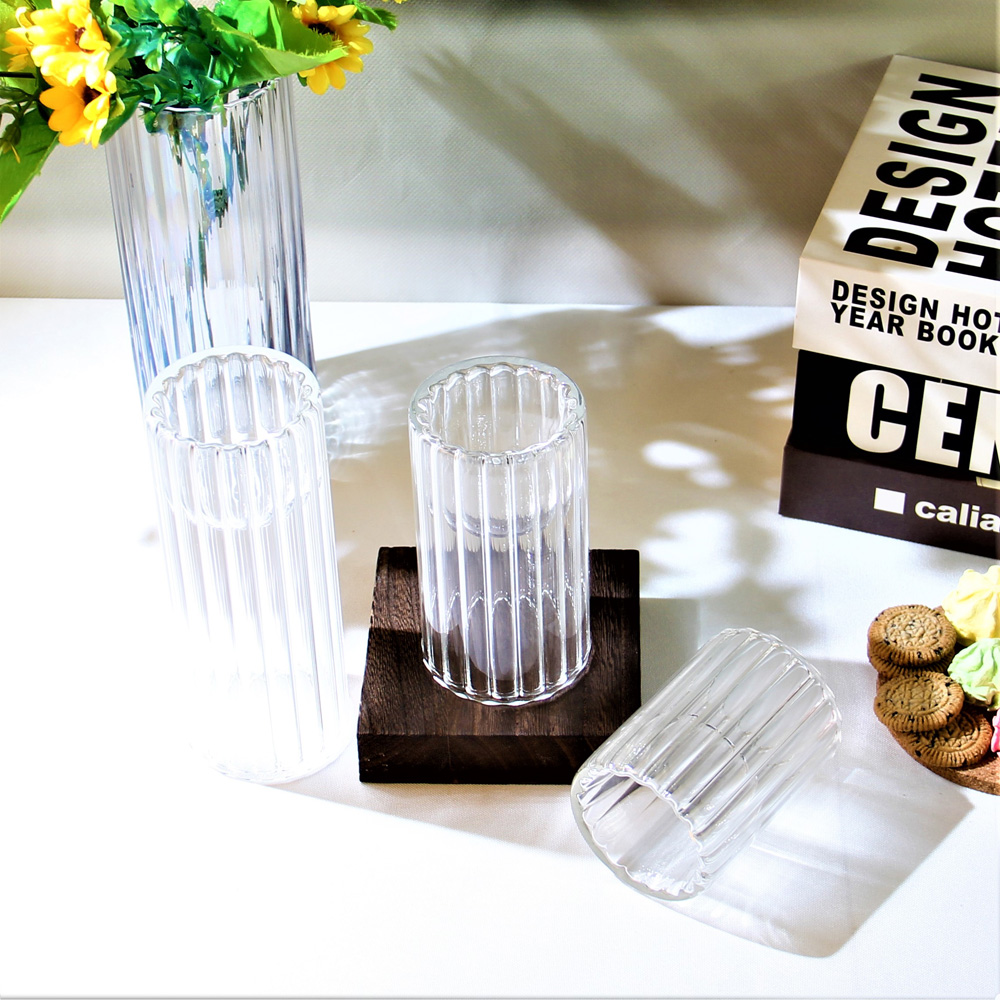 Cylindrical vertical ridged glass candlestick